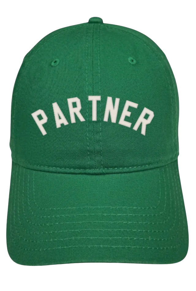 A green baseball cap with Partner embroidered across the front